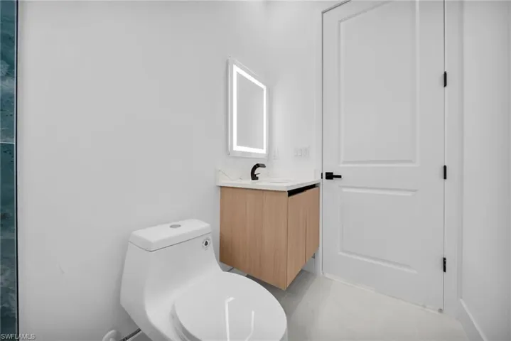 Bathroom featuring toilet and vanity