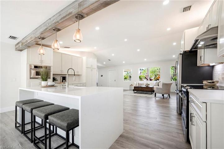 Completely remodeled! Kitchen & Dining Room area that overlooks the Living Room.