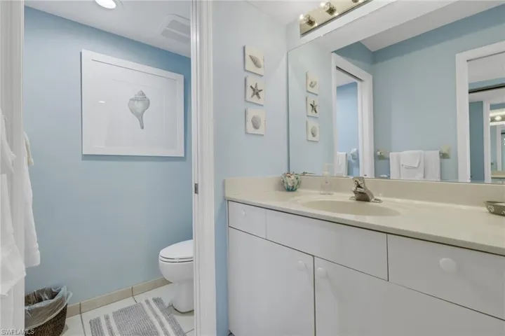 Bathroom with vanity and light tile patterned floors