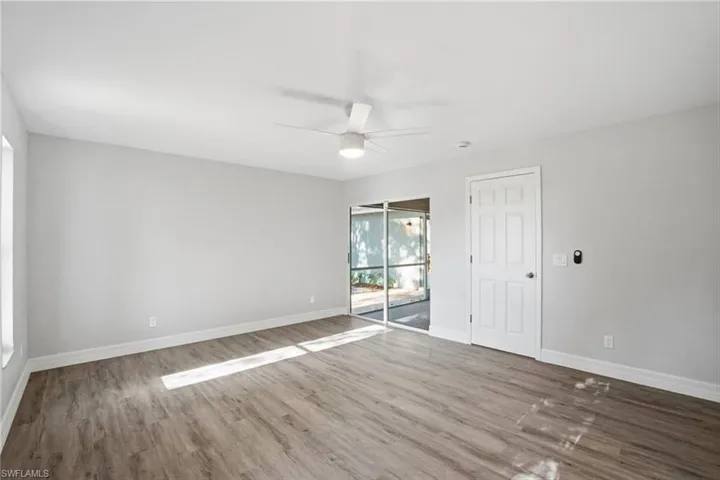 Unfurnished room featuring light wood finished floors and a ceiling fan