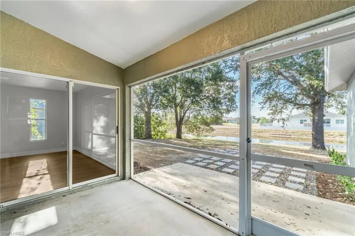 Unfurnished sunroom with vaulted ceiling