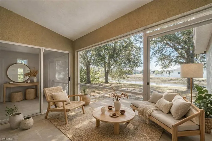 Sunroom with vaulted ceiling and a textured wall