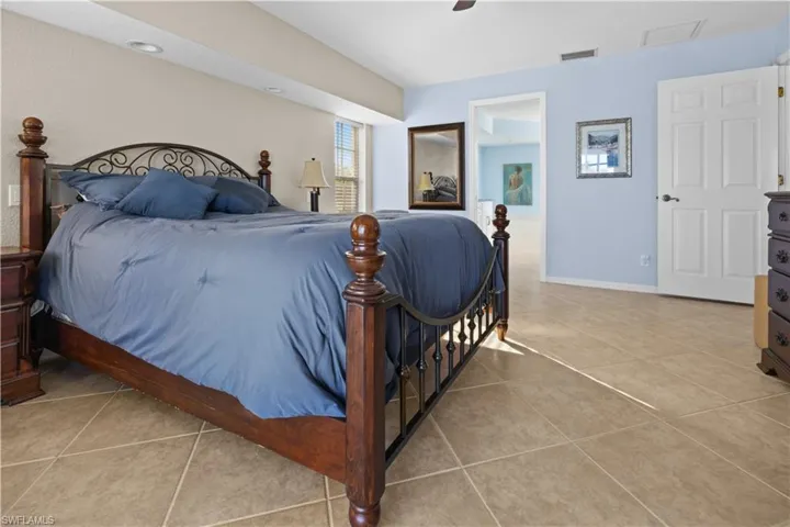 Bedroom featuring ceiling fan and light tile patterned flooring