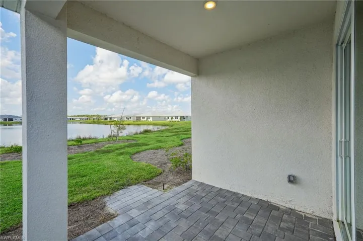 View of patio / terrace featuring a water view