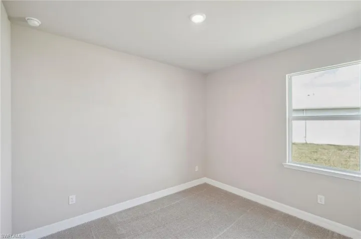 Spare room featuring carpet floors