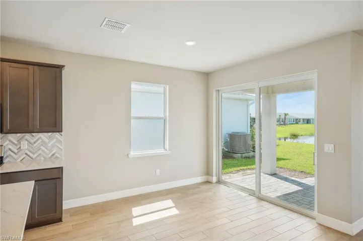 Entryway featuring light wood-type flooring and a water view