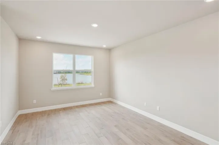 Spare room with light hardwood / wood-style flooring