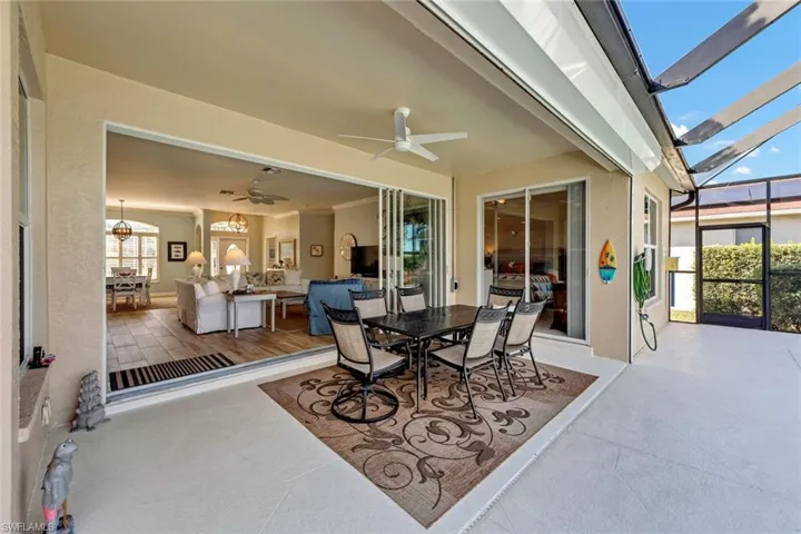 View of patio / terrace featuring a lanai and ceiling fan