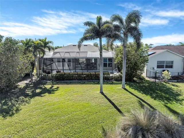 View of yard with a lanai
