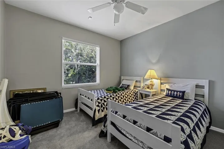 Bedroom featuring carpet flooring and ceiling fan
