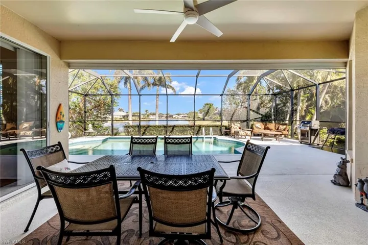 View of patio featuring glass enclosure