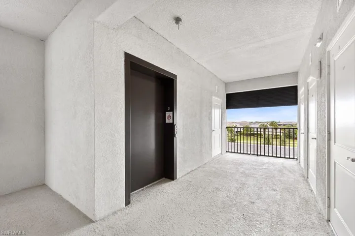 Corridor featuring elevator