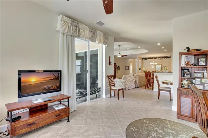 Tiled living room with ceiling fan