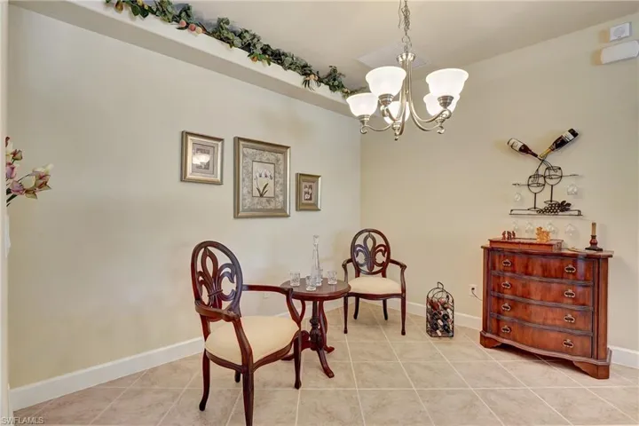 Sitting room featuring a notable chandelier and light tile patterned flooring