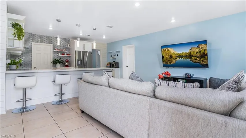 Living room featuring light tile patterned floors