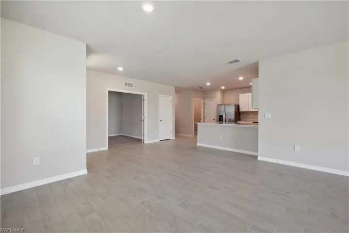 Unfurnished living room with light wood-type flooring