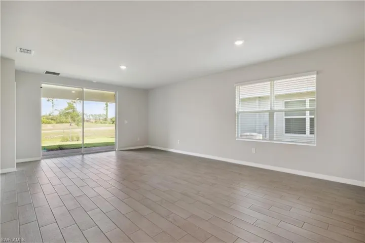 Unfurnished room with hardwood / wood-style floors