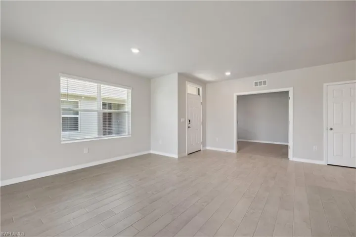 Empty room featuring light hardwood / wood-style flooring