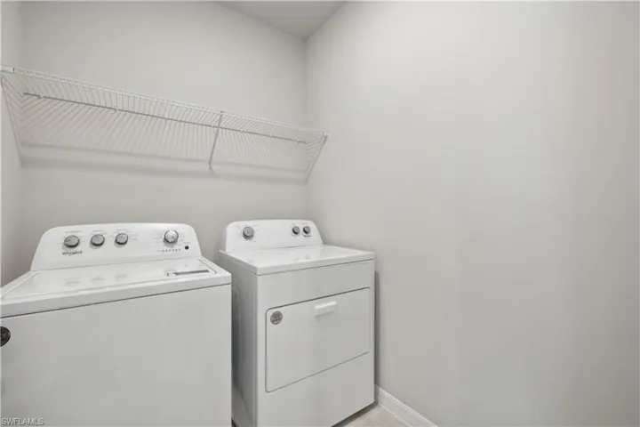 Clothes washing area with washing machine and clothes dryer