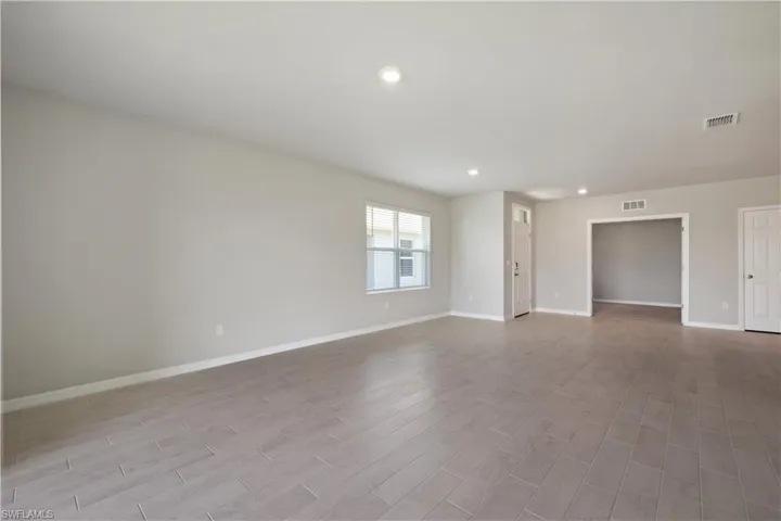 Spare room with light wood-type flooring