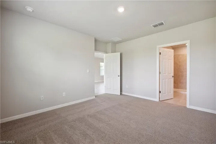 Unfurnished room featuring carpet floors