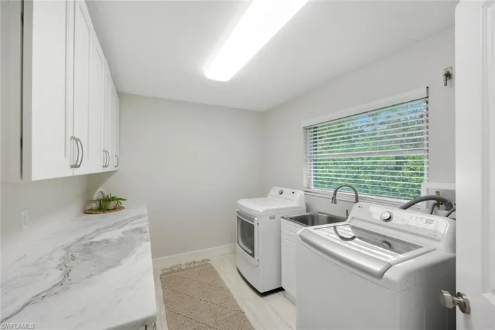 with sink, plenty of countertops and storage