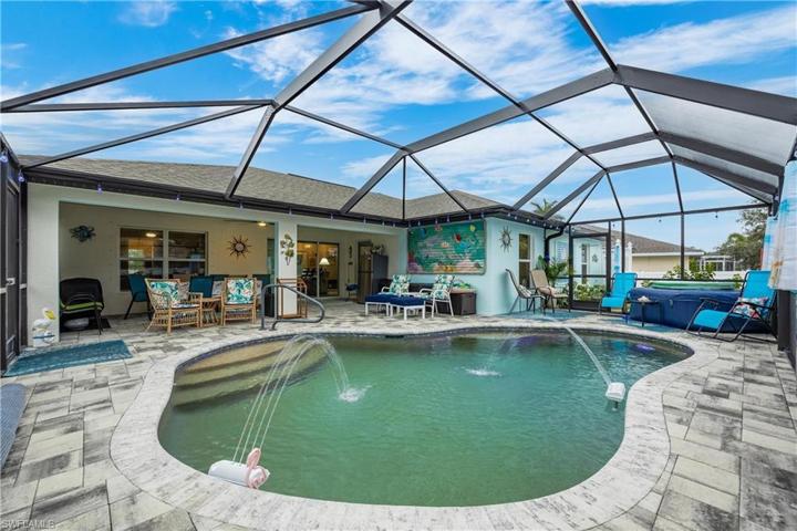 Custom PebbleTec finished Saltwater Heated Pool w/ fountains. Lighting in pool and around soffits that change colors. Custom fitted  pool cover also included.