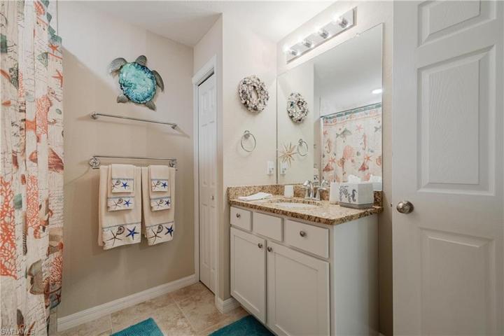 Guest Bathroom w/ granite countertop and shower/tub combo