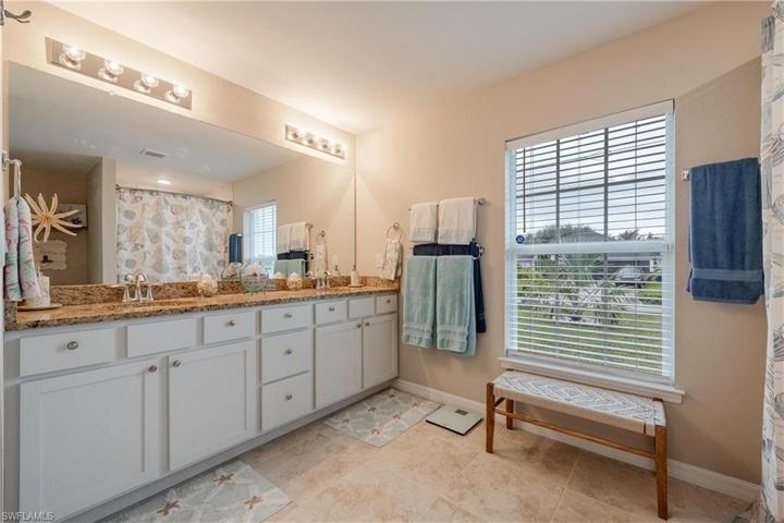Granite countertops, dual sink counter space, walk in tiled shower, and 2 master closets.