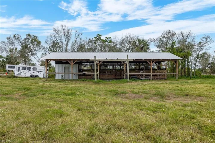 Horse barn with metal roof.