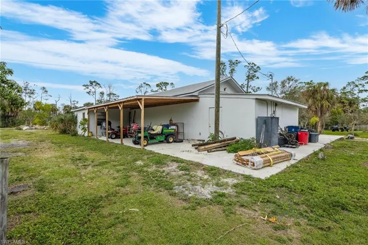 Detached garage with apartment and shop areas.