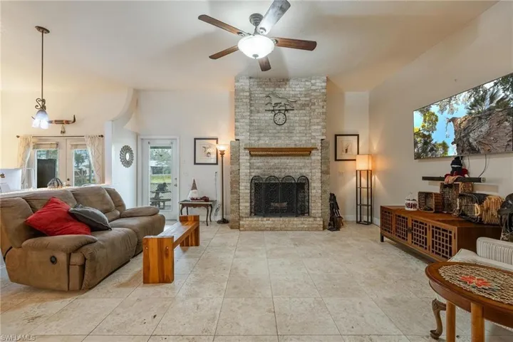 Looking back from fireplace toward front entrance door.