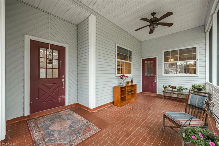 Screened front porch. Two entrances main and one into the kitchen area.