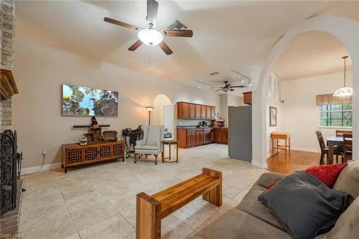 Living room with brick fireplace.
