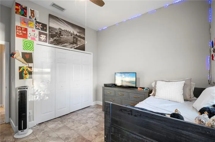 Bedroom with a closet and ceiling fan