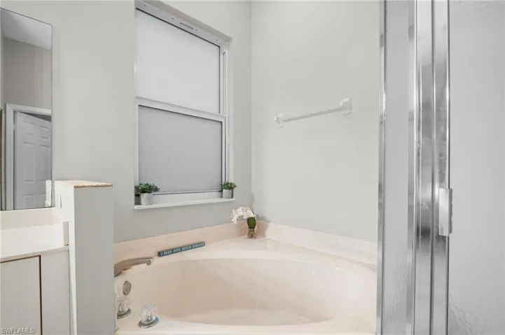 Full bathroom featuring a bath and vanity