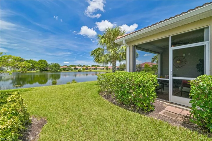 View of yard with a water view