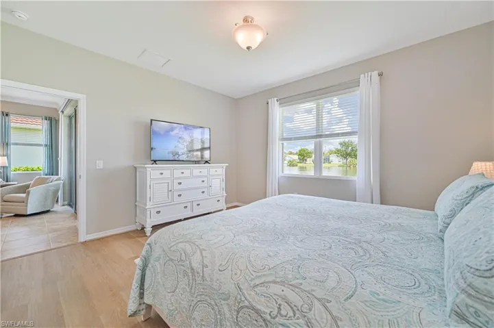 Bedroom with light hardwood / wood-style floors