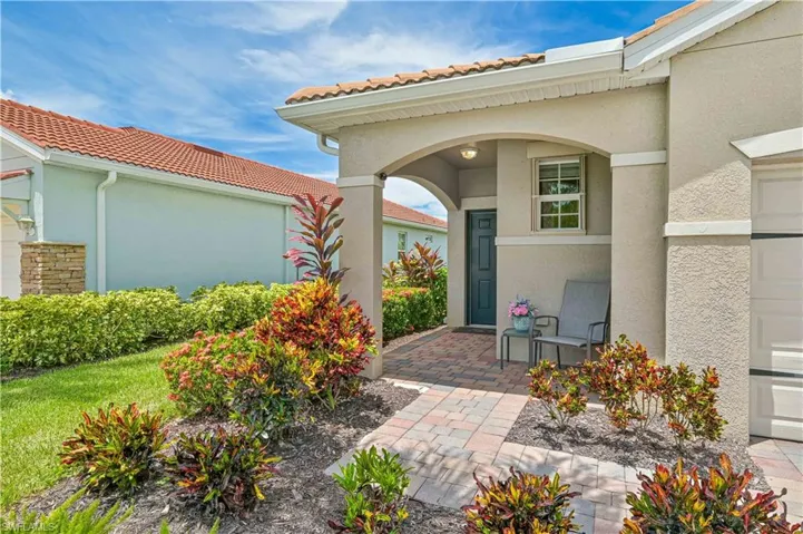 Doorway to property with a patio area