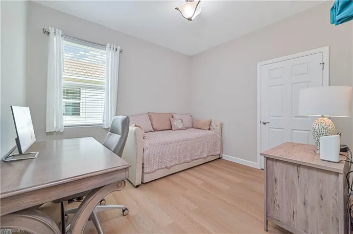 Bedroom with light hardwood / wood-style flooring