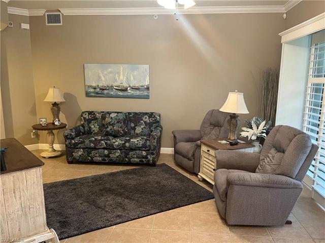 Oversize family room with plantation shutters on sliding glass door