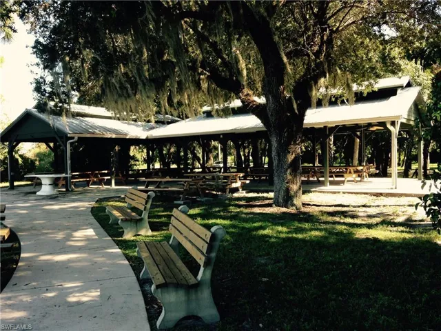 View of property's community featuring a patio and a yard