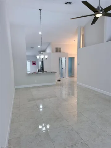 Valuted ceitings, new lighting fixtures looks out to a screen Lanai.