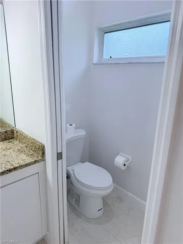 Private water closet with sliding pocket door!