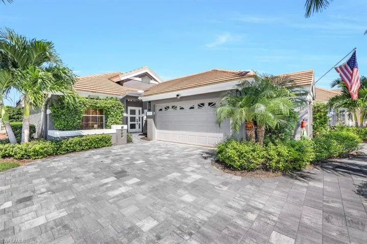 View of front of property featuring a garage