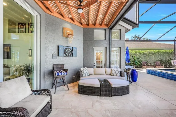 View of patio / terrace with ceiling fan, an outdoor hangout area, and a lanai
