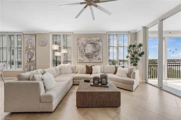 Custom molding and elegant plantation shutters add timeless character and refined style throughout.