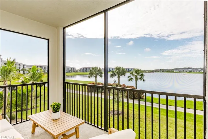 Sunroom with a water view