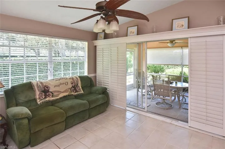 Tile flooring, vaulted ceiling, ceiling fan, sliding glass doors, interior plantation shutters