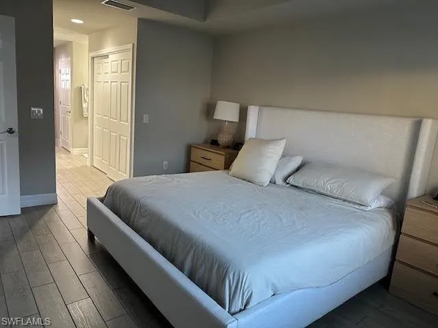 Bedroom featuring a closet and hardwood / wood-style floors